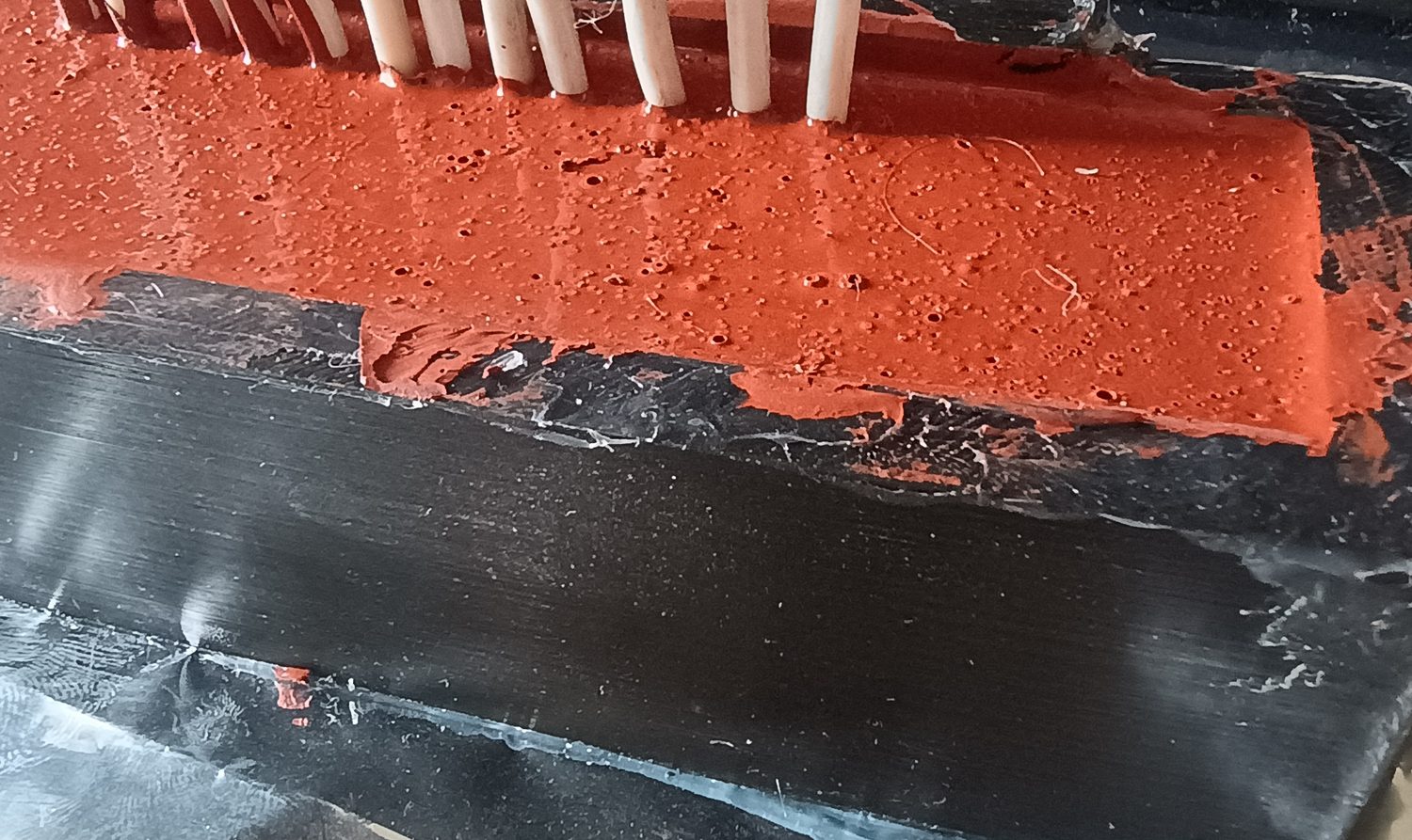 Cured polyurea gel inside a small black housing