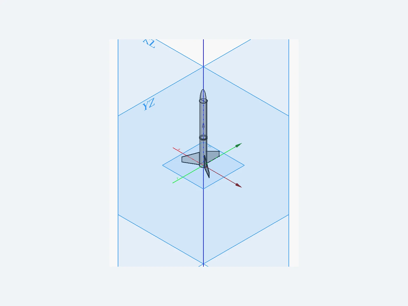 Front-oriented FreeCAD view of a compact rocket platform with body, nose, and three control surfaces